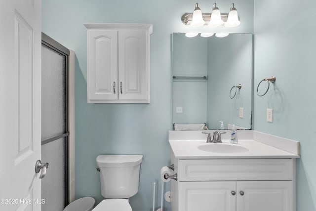 bathroom featuring toilet and vanity