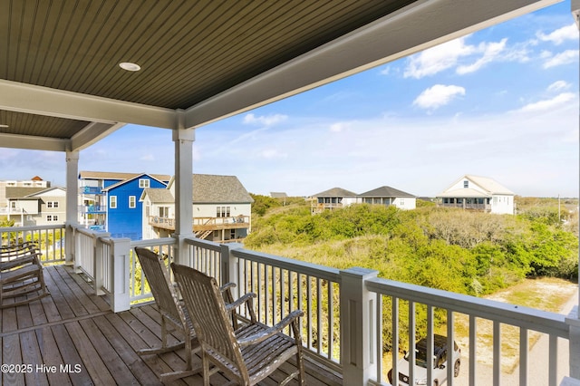 wooden deck featuring a residential view