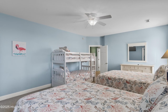 carpeted bedroom with baseboards and ceiling fan