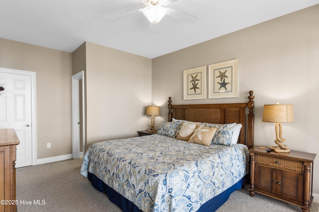 carpeted bedroom featuring baseboards and ceiling fan