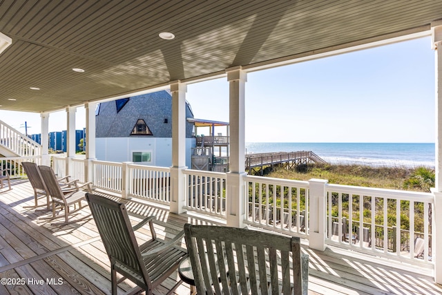 wooden deck with a water view