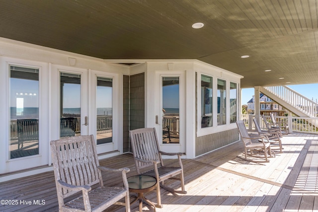 wooden deck featuring stairway