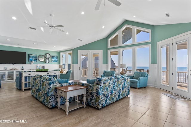living area with a ceiling fan, french doors, wainscoting, light tile patterned flooring, and recessed lighting