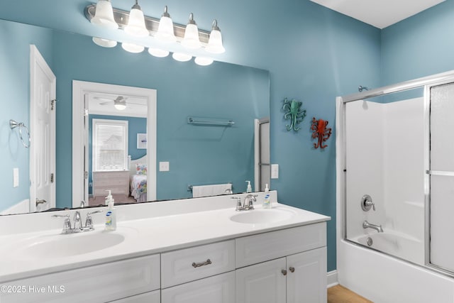bathroom with connected bathroom, double vanity, and combined bath / shower with glass door