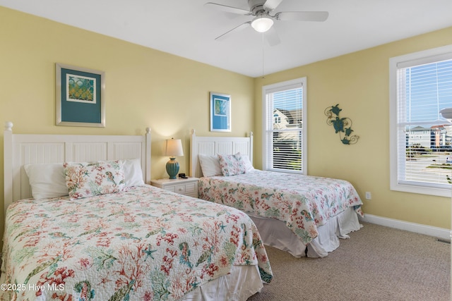bedroom featuring carpet, baseboards, and ceiling fan