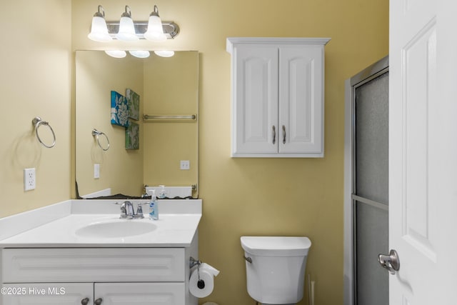 bathroom with toilet and vanity