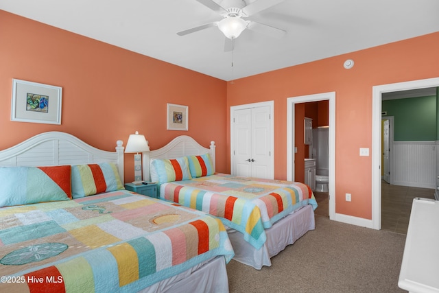 carpeted bedroom with a closet, a ceiling fan, and baseboards