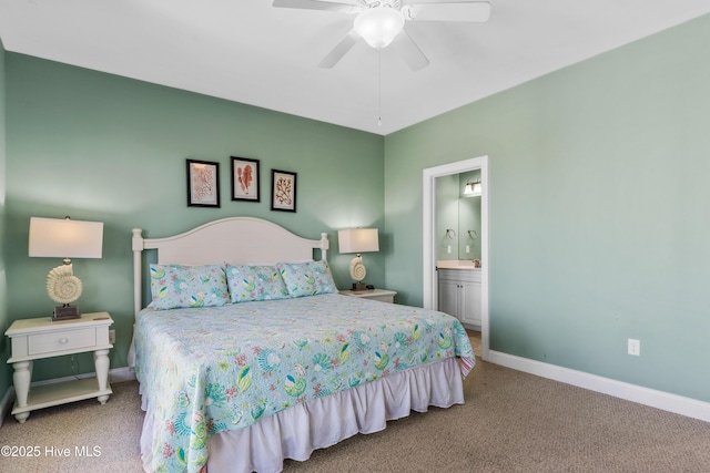 bedroom with carpet flooring, baseboards, and ensuite bathroom