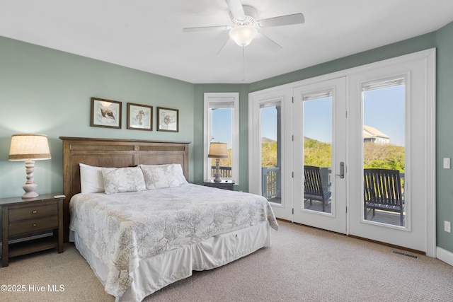 carpeted bedroom with access to outside, baseboards, and ceiling fan