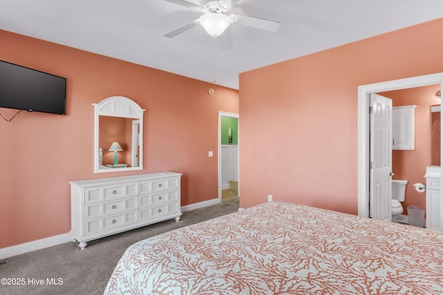 bedroom with carpet, baseboards, ceiling fan, and ensuite bathroom