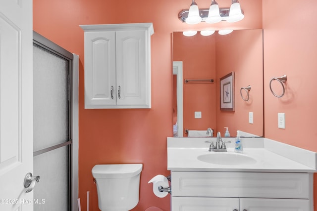 bathroom with toilet and vanity