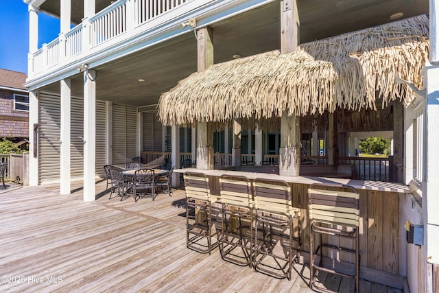 deck with outdoor dining area