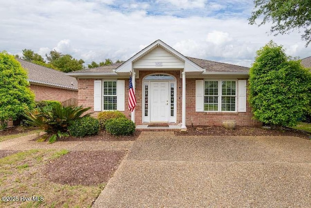 view of front of home with brick siding
