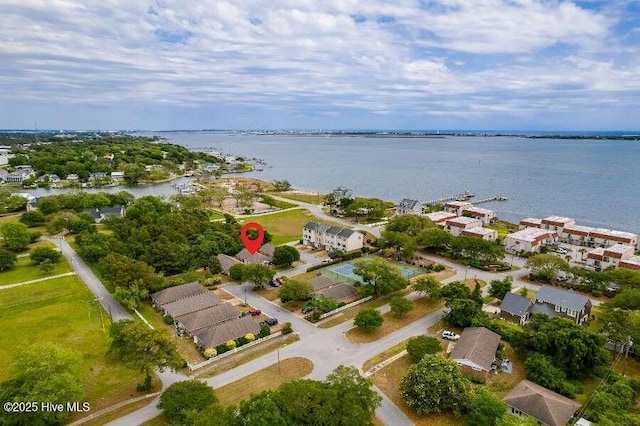 view of property location with a nearby body of water and nearby suburban area