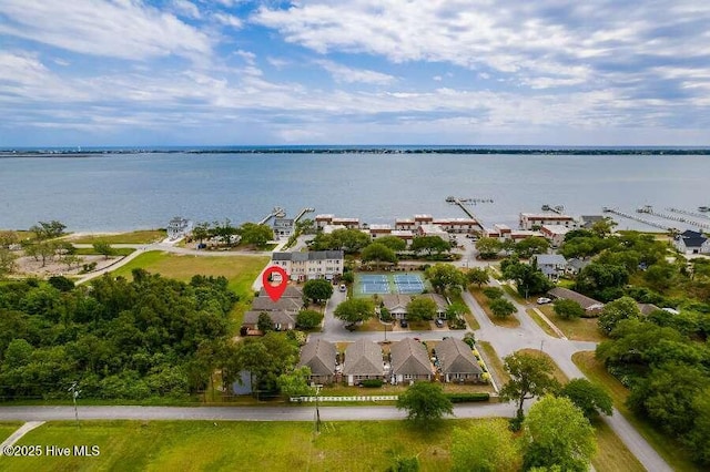aerial view of property and surrounding area featuring a large body of water
