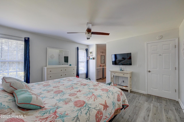 138 Cherokee Trl, Wilmington, NC 28409 - bedroom with light wood-style floors, a ceiling fan, and ensuite bath