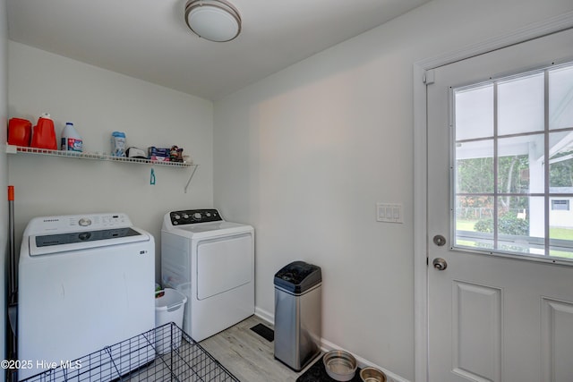 138 Cherokee Trl, Wilmington, NC 28409 - laundry room featuring separate washer and dryer, light wood finished floors, and baseboards