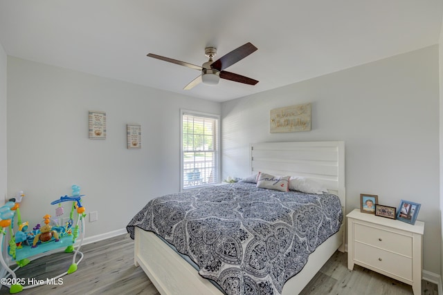 138 Cherokee Trl, Wilmington, NC 28409 - bedroom with light wood-style floors, baseboards, and a ceiling fan