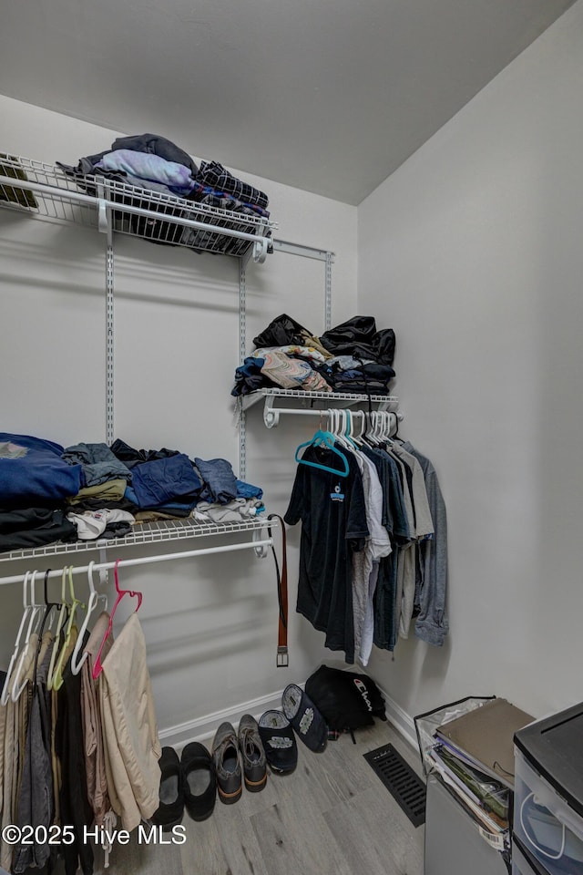 138 Cherokee Trl, Wilmington, NC 28409 - walk in closet featuring wood finished floors