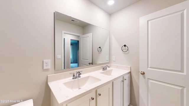 bathroom with double vanity