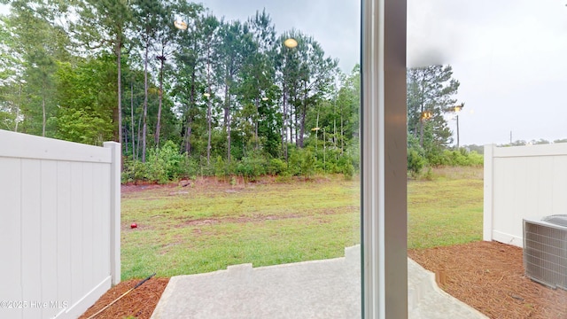 view of yard featuring a patio area and central AC unit