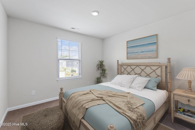 bedroom with carpet and baseboards