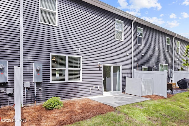 rear view of property with a patio area