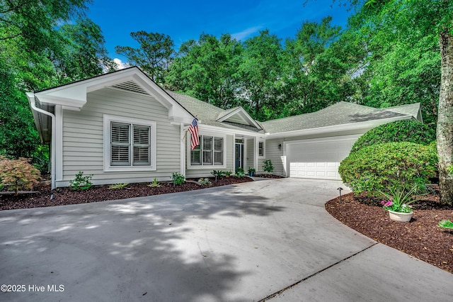 1204 Pine Valley Rd, North Myrtle Beach, SC 29582 - single story home with driveway, an attached garage, and a shingled roof