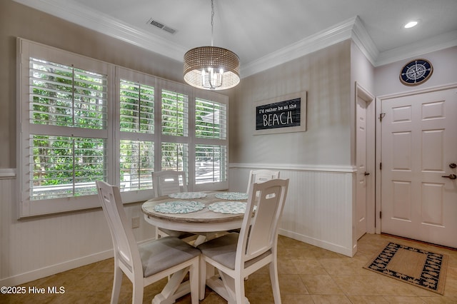 1204 Pine Valley Rd, North Myrtle Beach, SC 29582 - dining room with ornamental molding, light tile patterned floors, a chandelier, a wainscoted wall, and baseboards