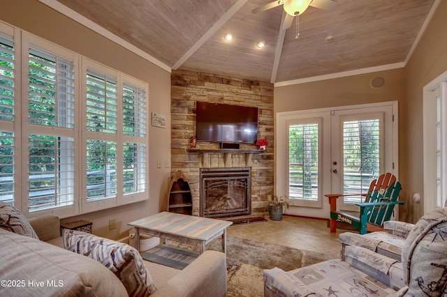 1204 Pine Valley Rd, North Myrtle Beach, SC 29582 - tiled living room with wood ceiling, healthy amount of natural light, crown molding, ceiling fan, and a stone fireplace