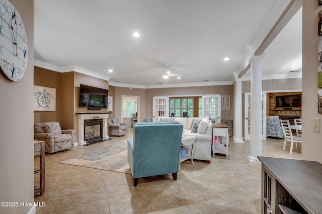 1204 Pine Valley Rd, North Myrtle Beach, SC 29582 - living area with ornate columns, ceiling fan, recessed lighting, a glass covered fireplace, and ornamental molding