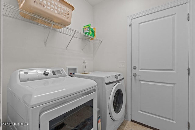 laundry room with washer and dryer