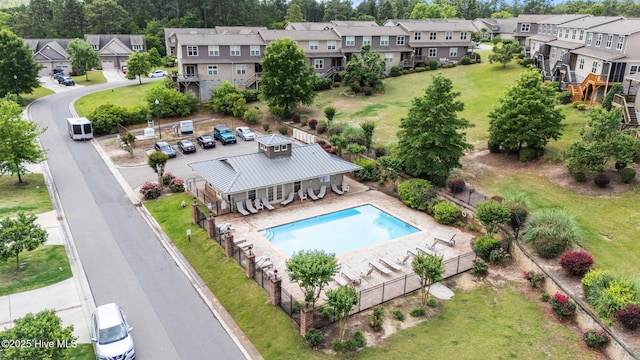aerial perspective of suburban area featuring a pool area