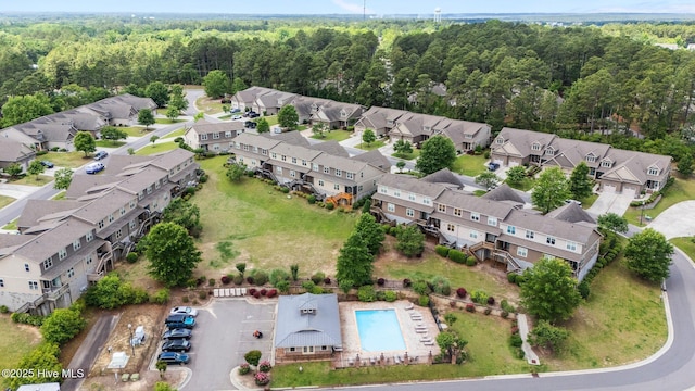 aerial perspective of suburban area with a heavily wooded area
