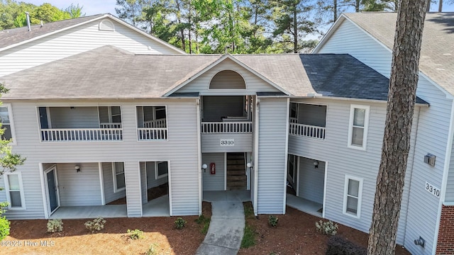 view of front facade with a shingled roof