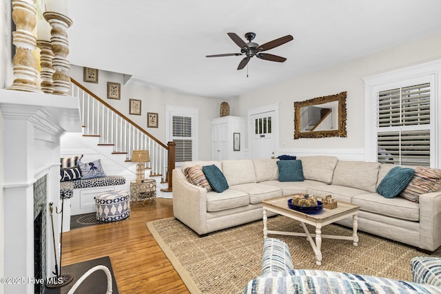 114 N Bonner St, Washington, NC 27889 - living room featuring a ceiling fan, wood finished floors, stairs, and a premium fireplace