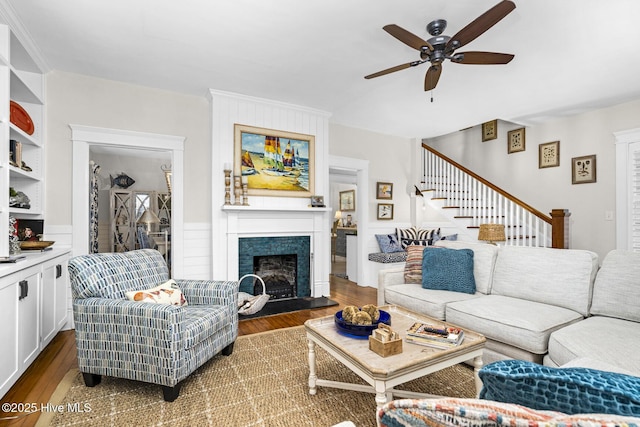 114 N Bonner St, Washington, NC 27889 - living area with ceiling fan, wood finished floors, a fireplace, and stairs