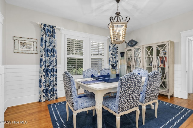 114 N Bonner St, Washington, NC 27889 - dining room with a chandelier, a wainscoted wall, and wood finished floors