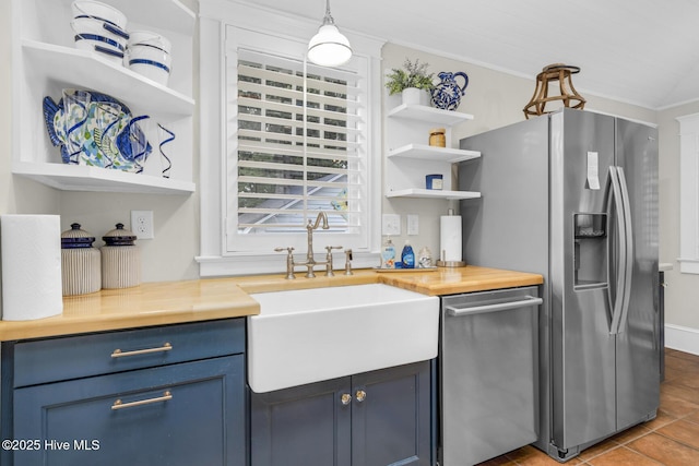 114 N Bonner St, Washington, NC 27889 - kitchen with open shelves, blue cabinets, a sink, stainless steel appliances, and ornamental molding