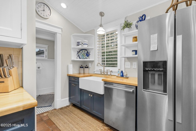 114 N Bonner St, Washington, NC 27889 - kitchen featuring appliances with stainless steel finishes, wooden counters, open shelves, a sink, and lofted ceiling