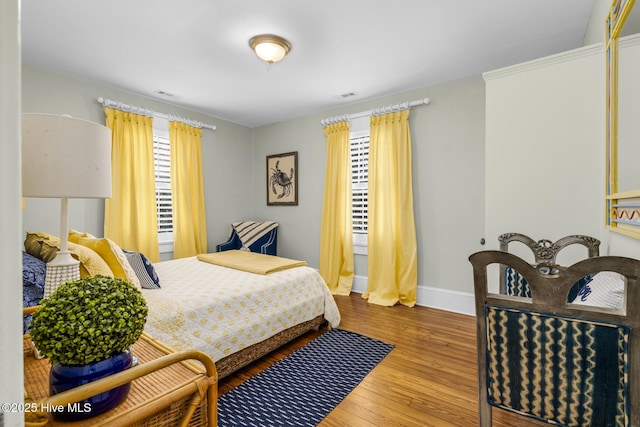114 N Bonner St, Washington, NC 27889 - bedroom featuring baseboards and wood finished floors