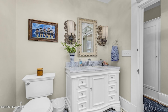 114 N Bonner St, Washington, NC 27889 - bathroom featuring toilet, vanity, and baseboards