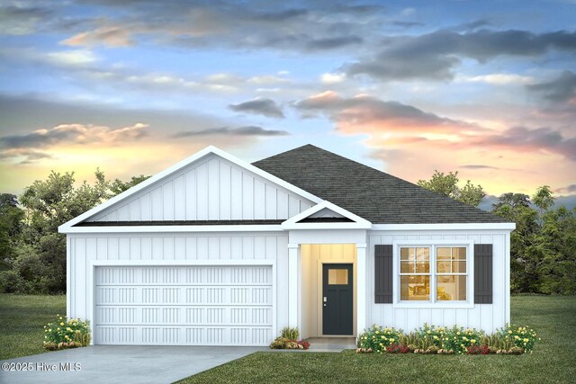 135 Legare St Lot 252, Wilmington, NC 28411 - view of front of property featuring a shingled roof, a garage, board and batten siding, and concrete driveway