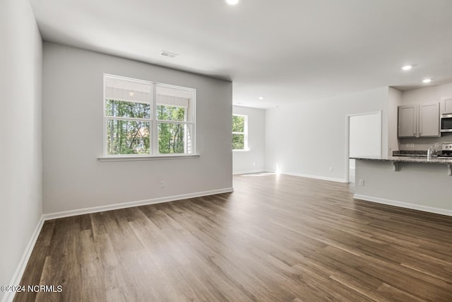 135 Legare St Lot 252, Wilmington, NC 28411 - unfurnished living room with dark wood-style floors and recessed lighting