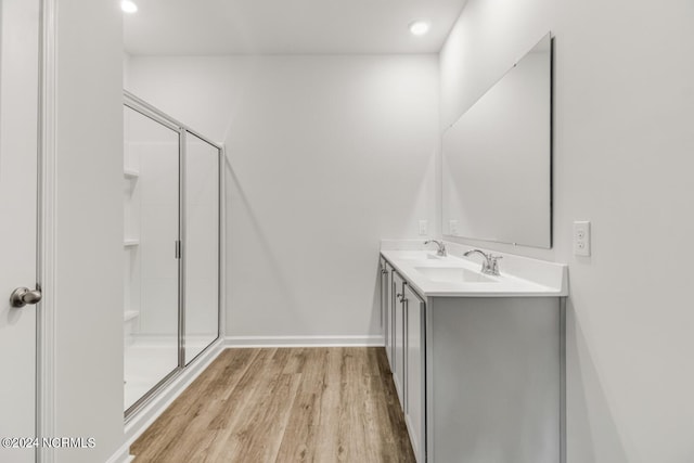 135 Legare St Lot 252, Wilmington, NC 28411 - bathroom with wood finished floors, a shower stall, double vanity, and recessed lighting