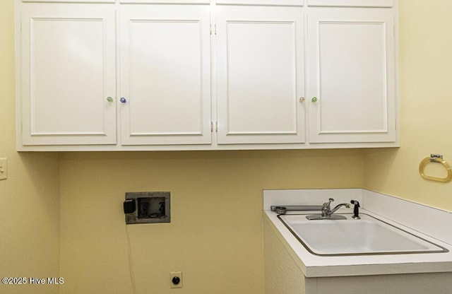 laundry room with cabinet space, hookup for an electric dryer, and washer hookup