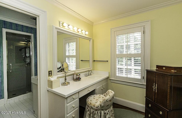 bathroom featuring crown molding, a stall shower, vanity, and baseboards