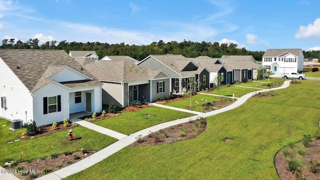 view of front of home featuring a shingled roof, board and batten siding, a residential view, and a front lawn