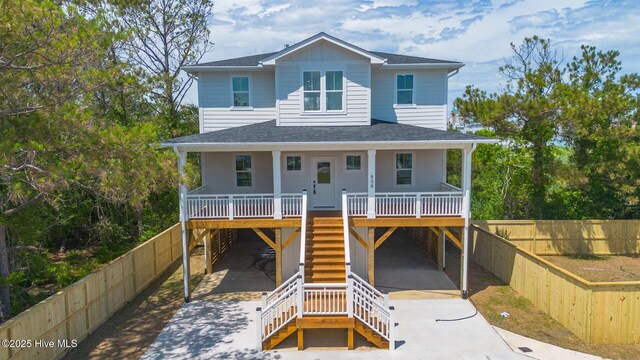 808 S 2nd St, Carolina Beach, NC 28428 - beach home featuring a carport, covered porch, concrete driveway, and stairway