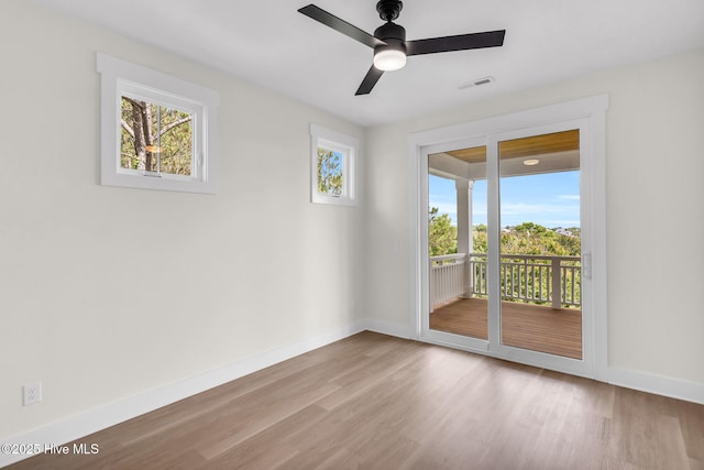 808 S 2nd St, Carolina Beach, NC 28428 - unfurnished room with baseboards, wood finished floors, and a ceiling fan
